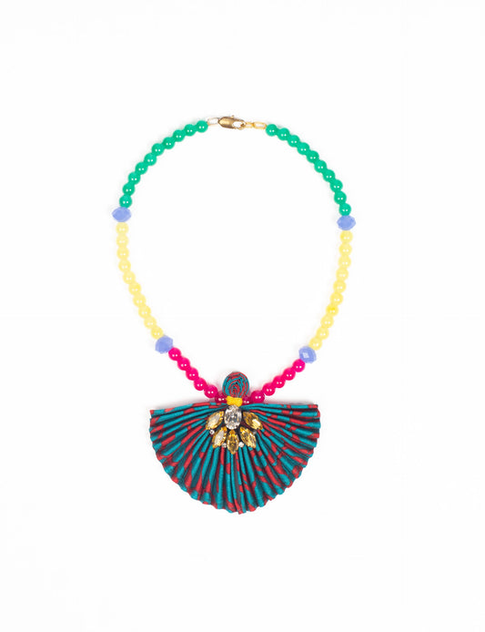 Dive into sustainable fashion with our PLEATED NECKLACE, a creation by talented female artisans in Mumbai. The pleated fan pendant, made from upcycled saris, hangs on a colorful necklace crafted from glass beads, embellished with sparkling glass crystals. An ethical, green fashion statement for conscious styling.