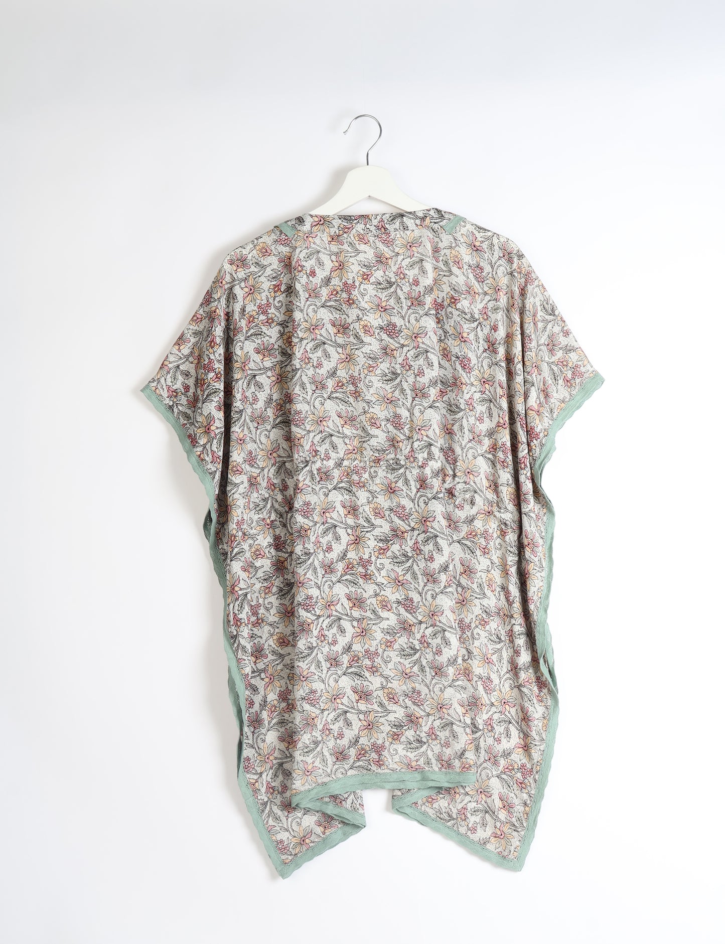 Elevate your style with our short kaftan, a perfect blend of ethical and green fashion. The light and loose-flowing fabric, drawstring waist, beaded tassel ends, and delicate lace edging make it a versatile choice for urban summers, beachwear, or poolside elegance. Enjoy sustainable and fashionable living.