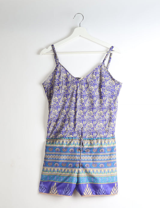 Vibrant playsuit with lace accents, crafted from upcycled saris. Embrace ethical fashion with this unique piece designed for conscious consumers.