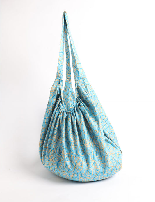A stylish HOBO BAG made from recycled materials, perfect for eco-conscious fashionistas.