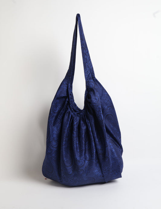 A stylish HOBO BAG made from recycled materials, perfect for eco-conscious fashionistas.