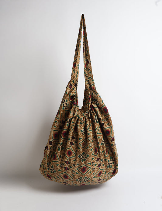 A stylish HOBO BAG made from recycled materials, perfect for eco-conscious fashionistas.