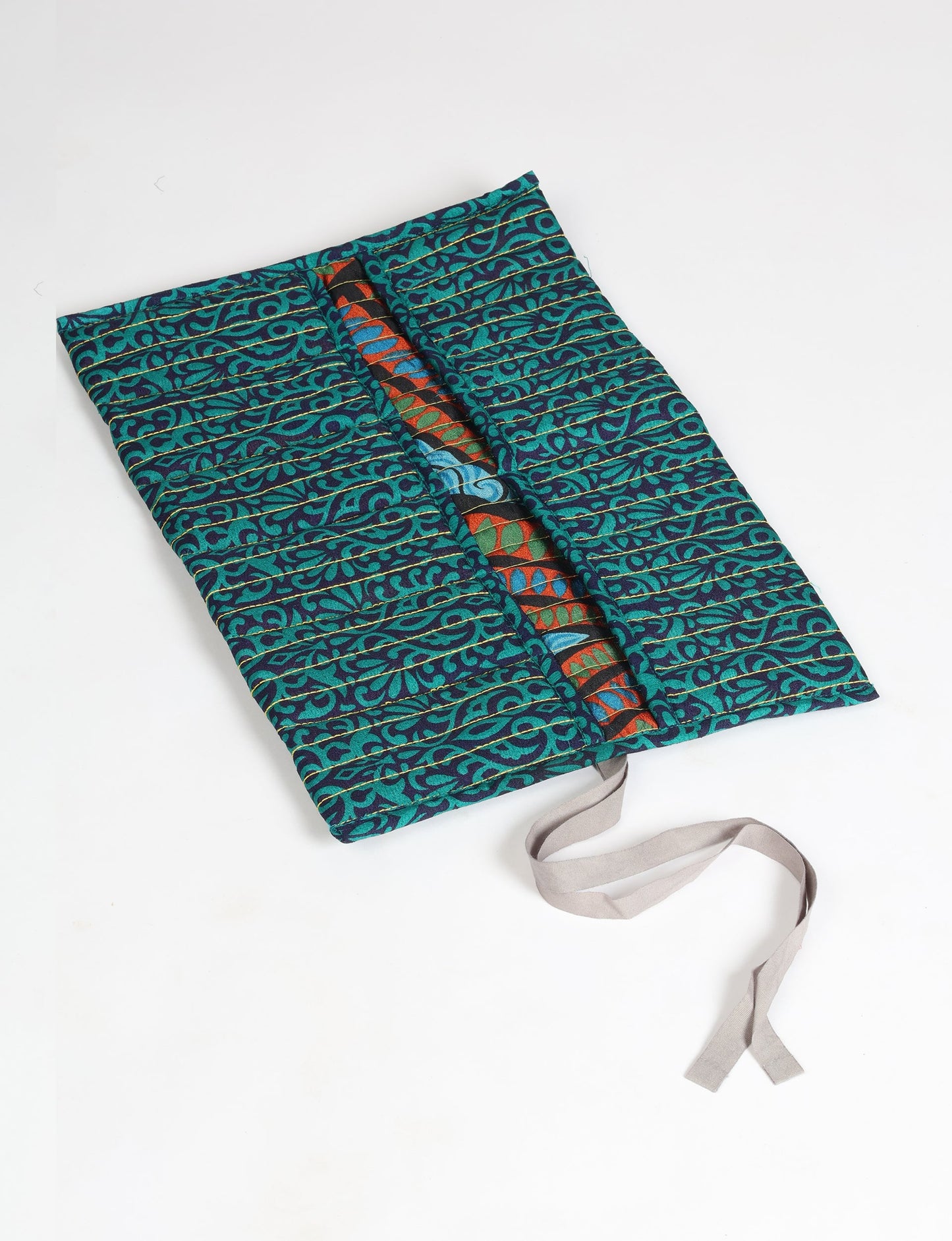 Roll-Up Organizer made from repurposed sari fabric, showcasing compact design and sustainable fashion innovation.