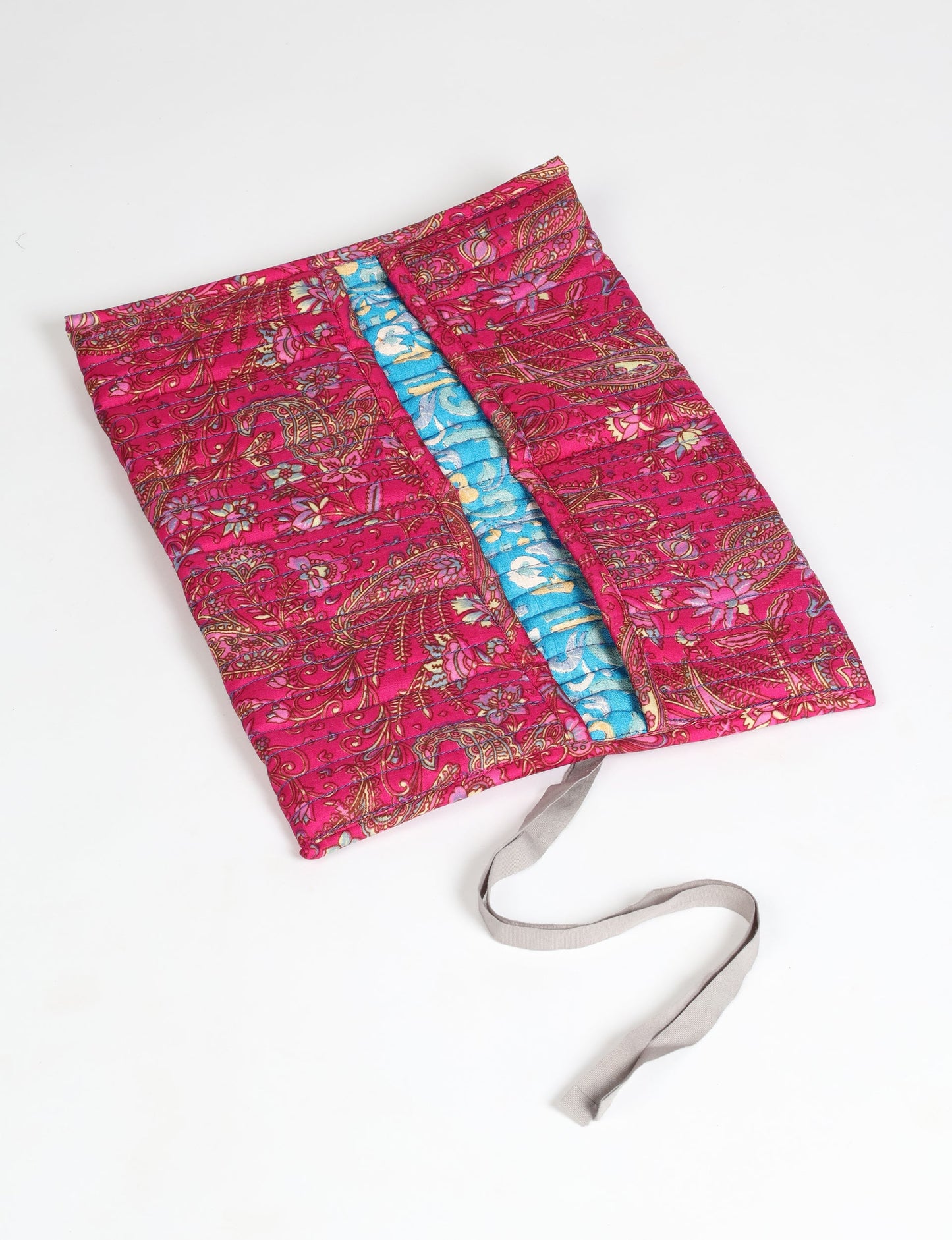 Roll-Up Organizer made from repurposed sari fabric, showcasing compact design and sustainable fashion innovation.