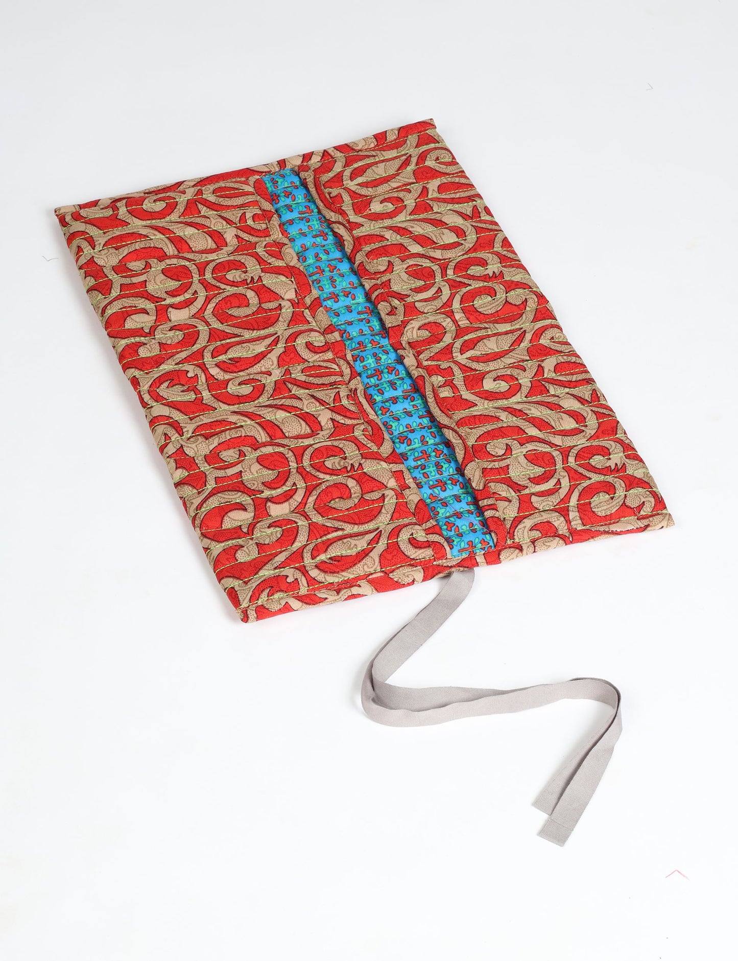 Roll-Up Organizer made from repurposed sari fabric, showcasing compact design and sustainable fashion innovation.