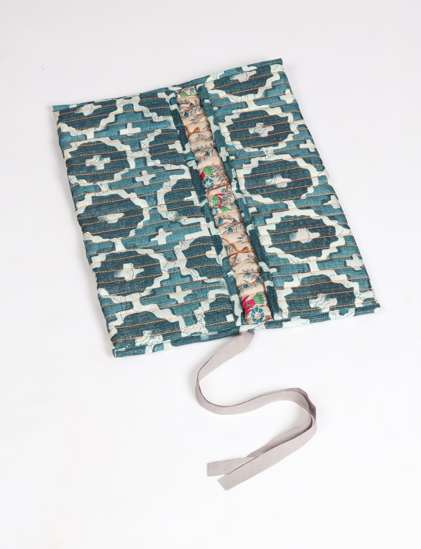 Roll-Up Organizer made from repurposed sari fabric, showcasing compact design and sustainable fashion innovation.