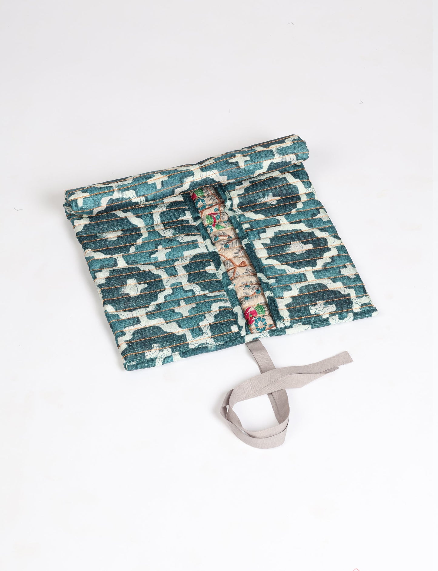 Roll-Up Organizer made from repurposed sari fabric, showcasing compact design and sustainable fashion innovation.