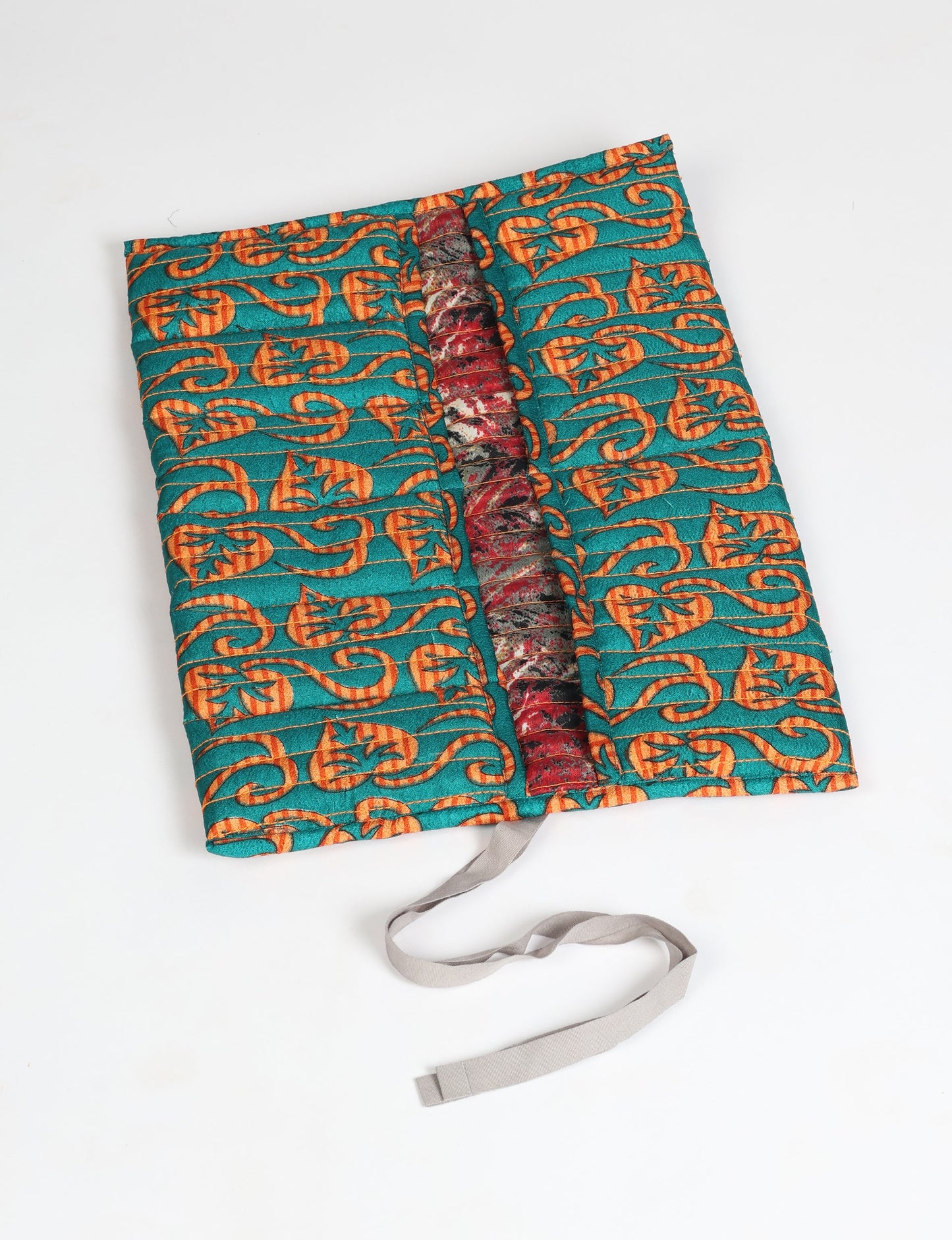 Roll-Up Organizer made from repurposed sari fabric, showcasing compact design and sustainable fashion innovation.