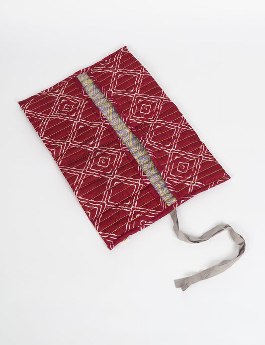 Roll-Up Organizer made from repurposed sari fabric, showcasing compact design and sustainable fashion innovation.
