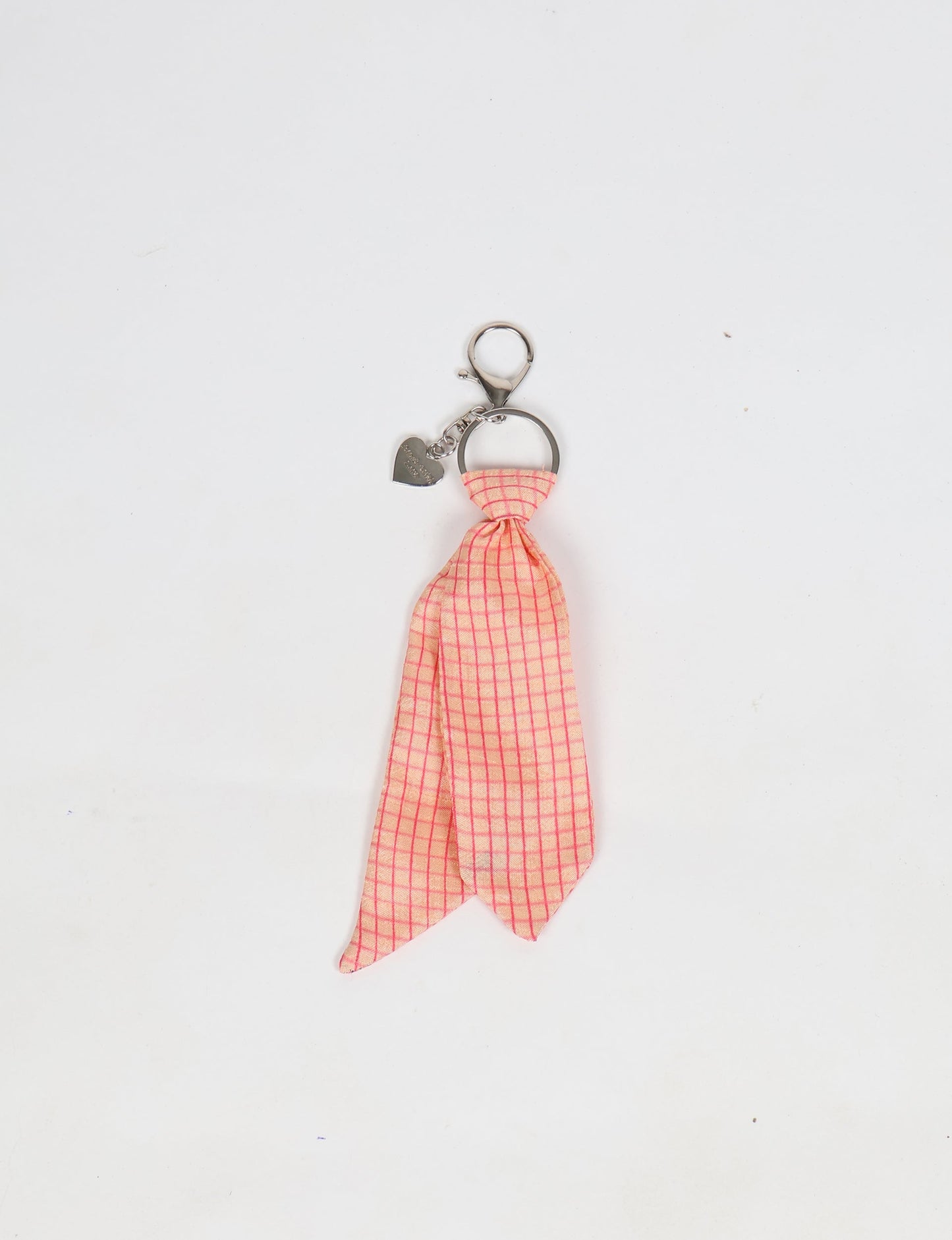 Upcycled sari tie keychain with loop detail, made from recycled fashion waste in vibrant prints—eco clothing accessory for green fashion lovers, promoting slow fashion, recycled material clothing, and climate neutral fashion.