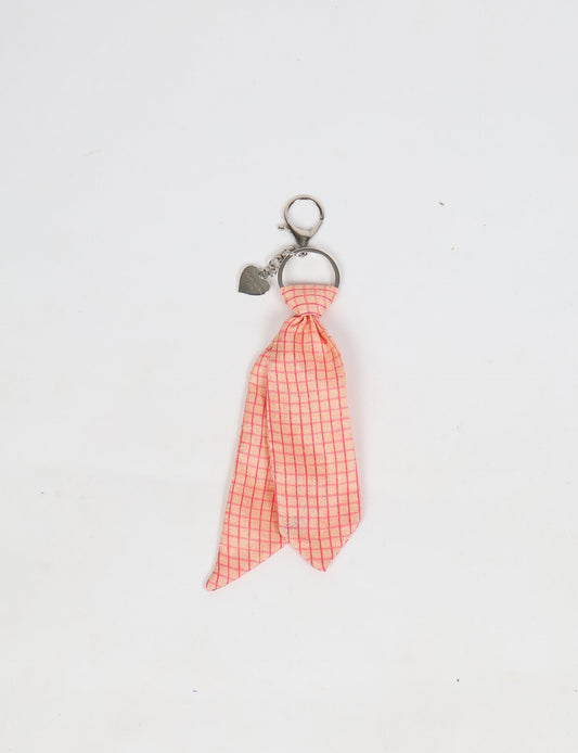 Upcycled sari tie keychain with loop detail, made from recycled fashion waste in vibrant prints—eco clothing accessory for green fashion lovers, promoting slow fashion, recycled material clothing, and climate neutral fashion.