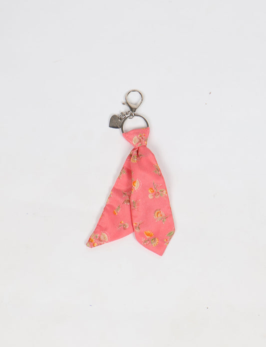 Upcycled sari tie keychain with loop detail, made from recycled fashion waste in vibrant prints—eco clothing accessory for green fashion lovers, promoting slow fashion, recycled material clothing, and climate neutral fashion.