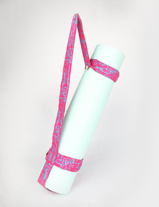 A green yoga mat holder made from upcycled materials, embodying ethical and sustainable fashion ideals.