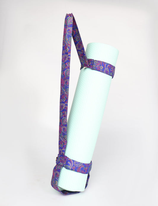 A green yoga mat holder made from upcycled materials, embodying ethical and sustainable fashion ideals.