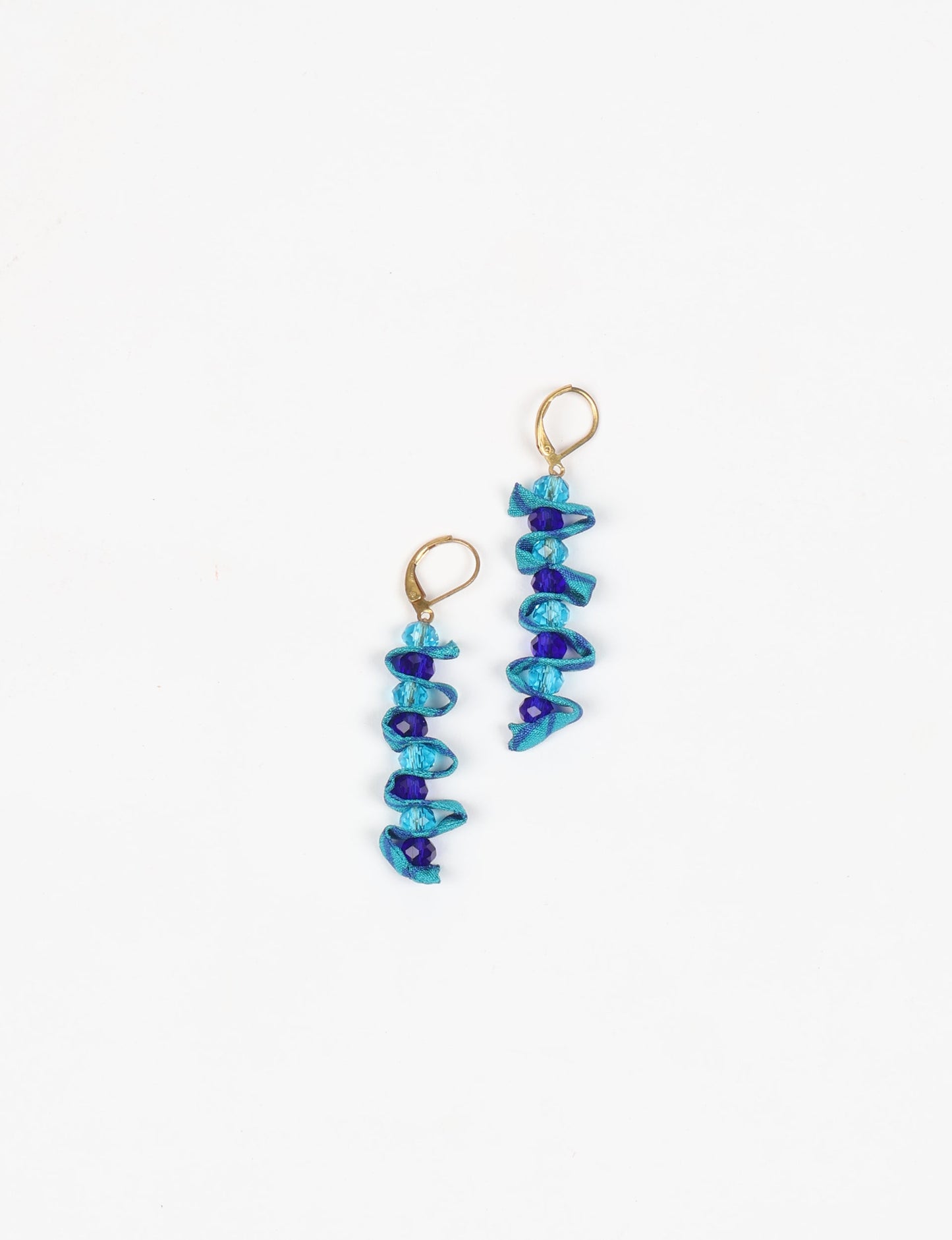 Wavy Dangler Earrings made from upcycled materials, showcasing eco-friendly fashion and sustainable women's clothing. A delicate blend of style and environmentally friendly design, perfect for those who value conscious clothing and circular fashion.
