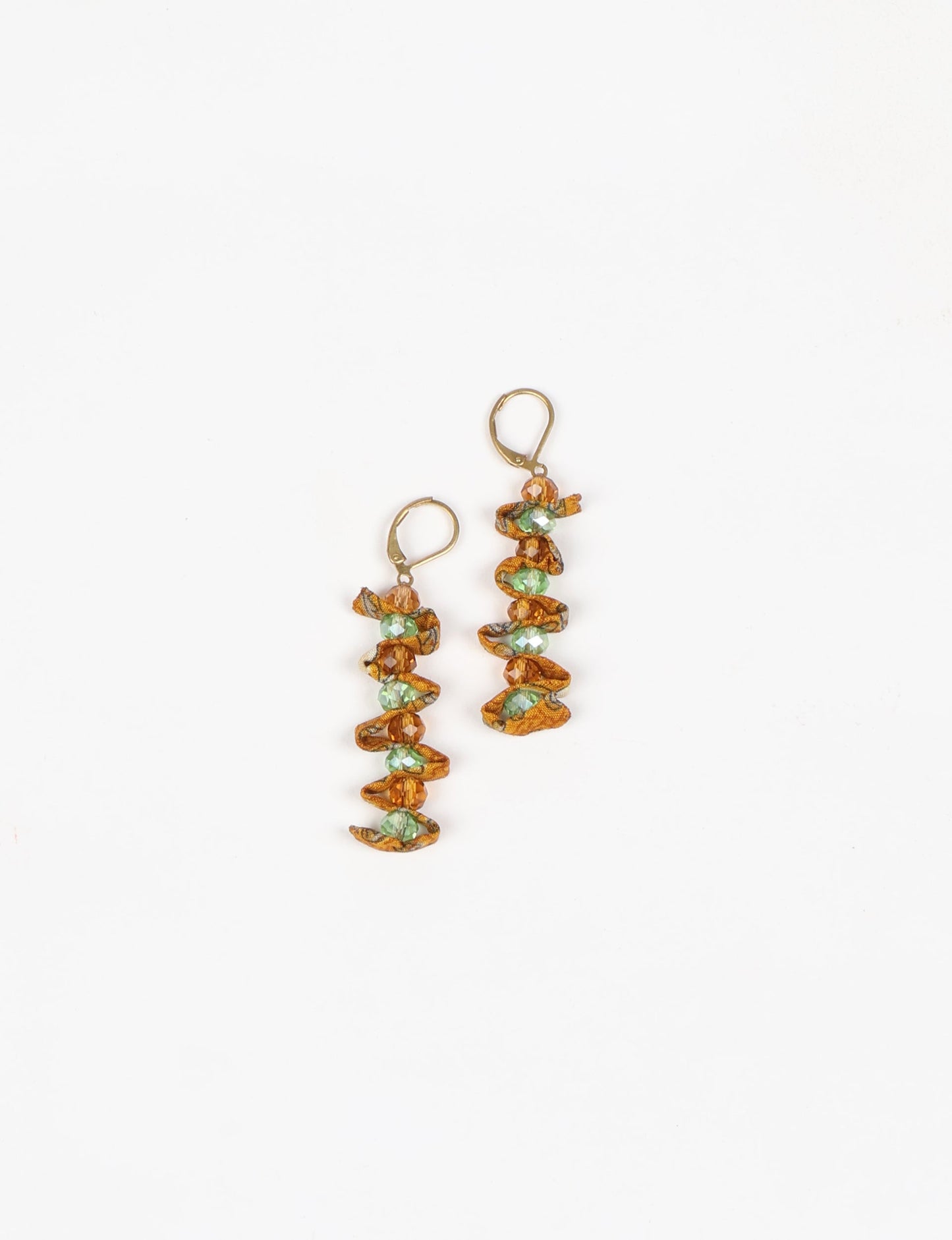 Wavy Dangler Earrings made from upcycled materials, showcasing eco-friendly fashion and sustainable women's clothing. A delicate blend of style and environmentally friendly design, perfect for those who value conscious clothing and circular fashion.