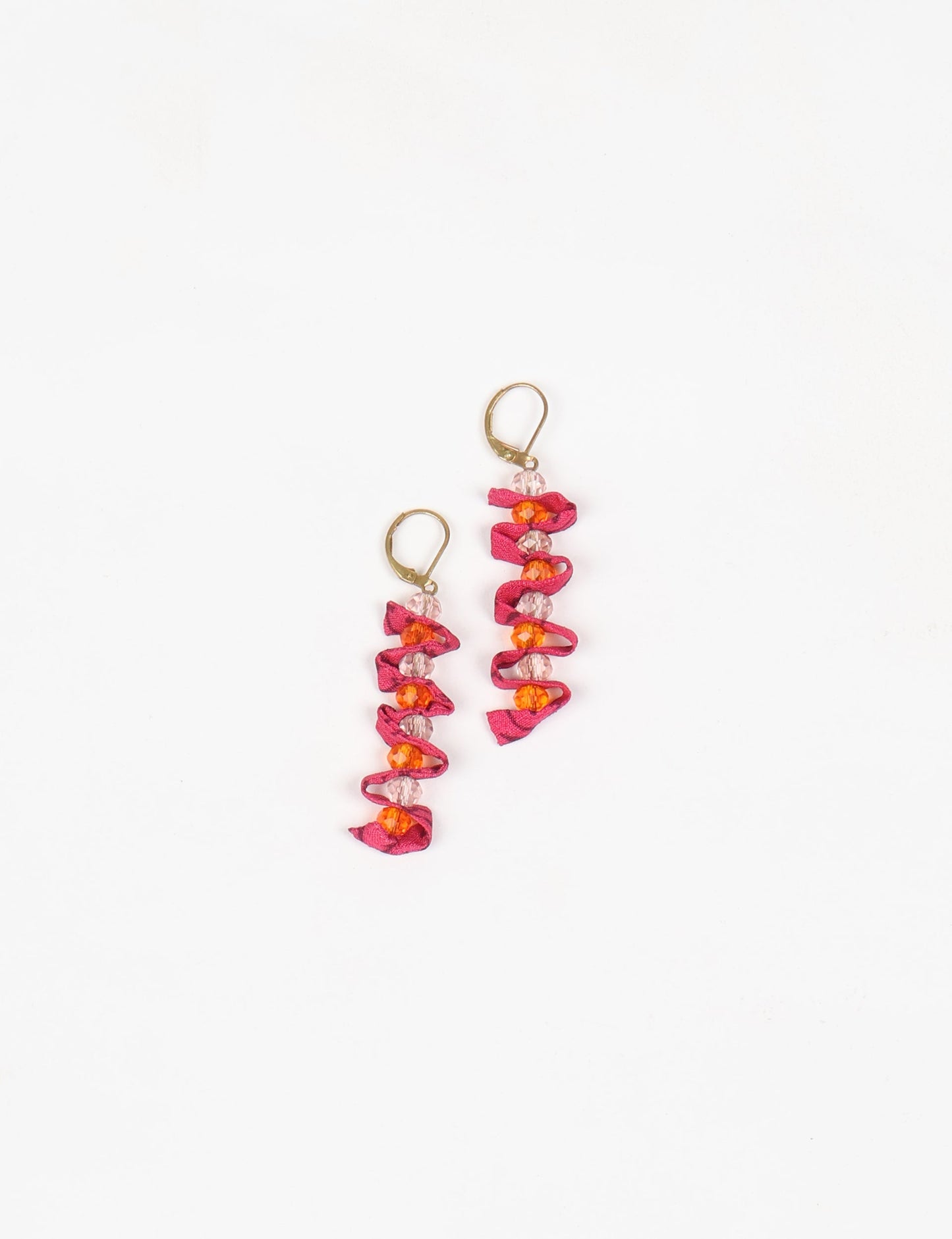 Wavy Dangler Earrings made from upcycled materials, showcasing eco-friendly fashion and sustainable women's clothing. A delicate blend of style and environmentally friendly design, perfect for those who value conscious clothing and circular fashion.