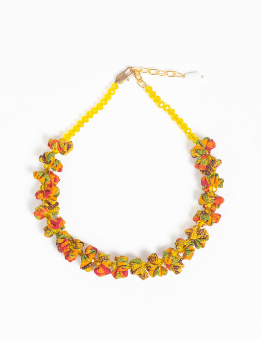 Floret Necklace with vibrant beaded accents, designed from recycled materials, embodying upcycled women’s clothing and green fashion ideals. Perfect eco-friendly fashion accessory for sustainable apparel enthusiasts.