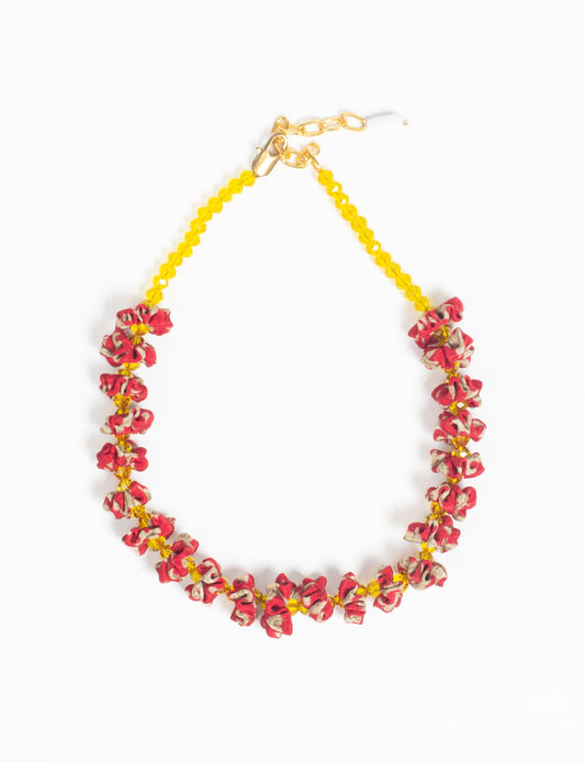 Floret Necklace with vibrant beaded accents, designed from recycled materials, embodying upcycled women’s clothing and green fashion ideals. Perfect eco-friendly fashion accessory for sustainable apparel enthusiasts.