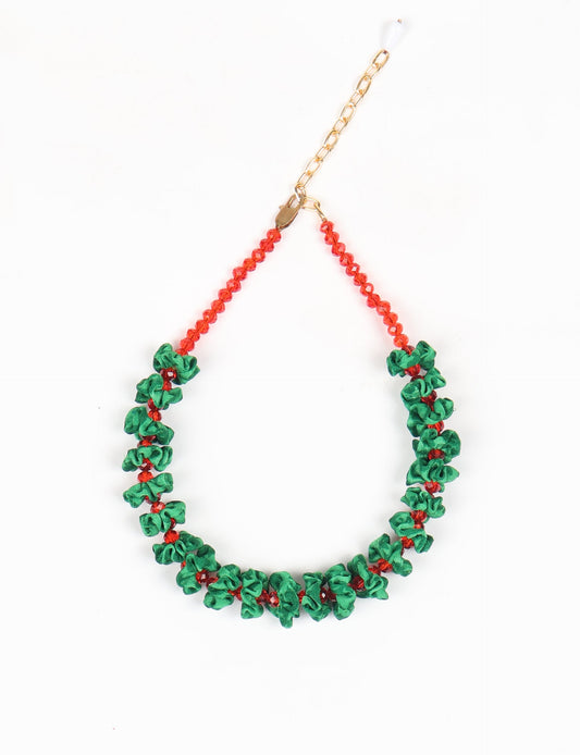 Floret Necklace with vibrant beaded accents, designed from recycled materials, embodying upcycled women’s clothing and green fashion ideals. Perfect eco-friendly fashion accessory for sustainable apparel enthusiasts.