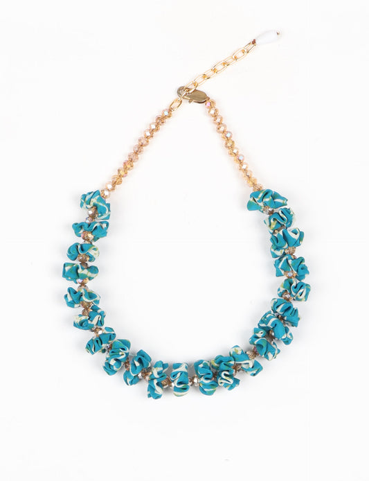 Floret Necklace with vibrant beaded accents, designed from recycled materials, embodying upcycled women’s clothing and green fashion ideals. Perfect eco-friendly fashion accessory for sustainable apparel enthusiasts.