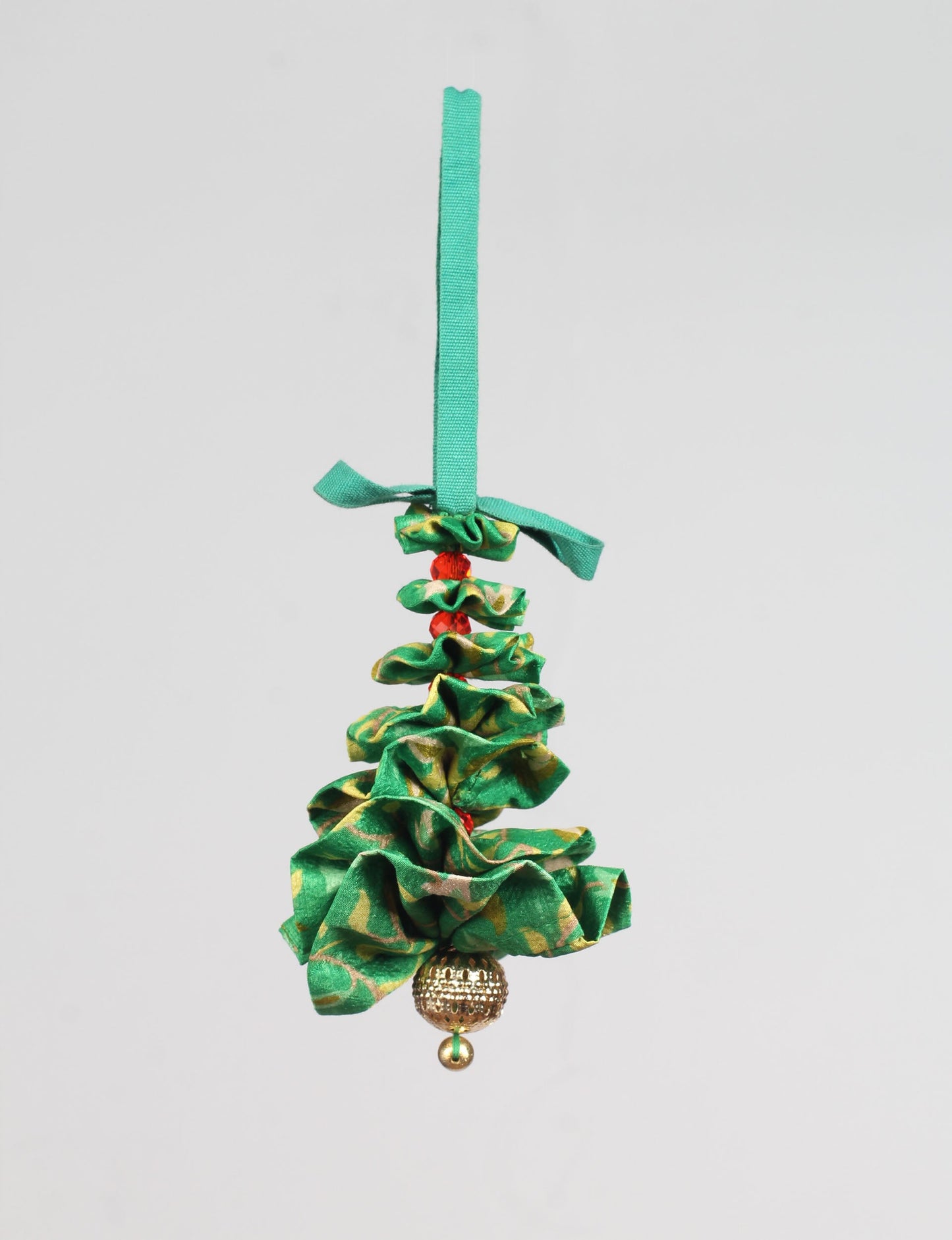 Tree Christmas Ornament crafted from upcycled materials, showcasing sustainable fashion and eco-friendly design, a delightful addition to holiday décor made from recycled and repurposed fabrics.