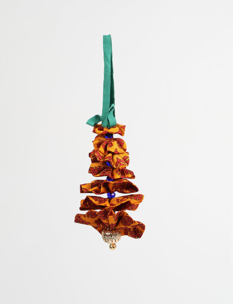 Yellow fabric Christmas tree ornament with red leaf pattern, blue beads, gold bell, and green hanging loop, front view