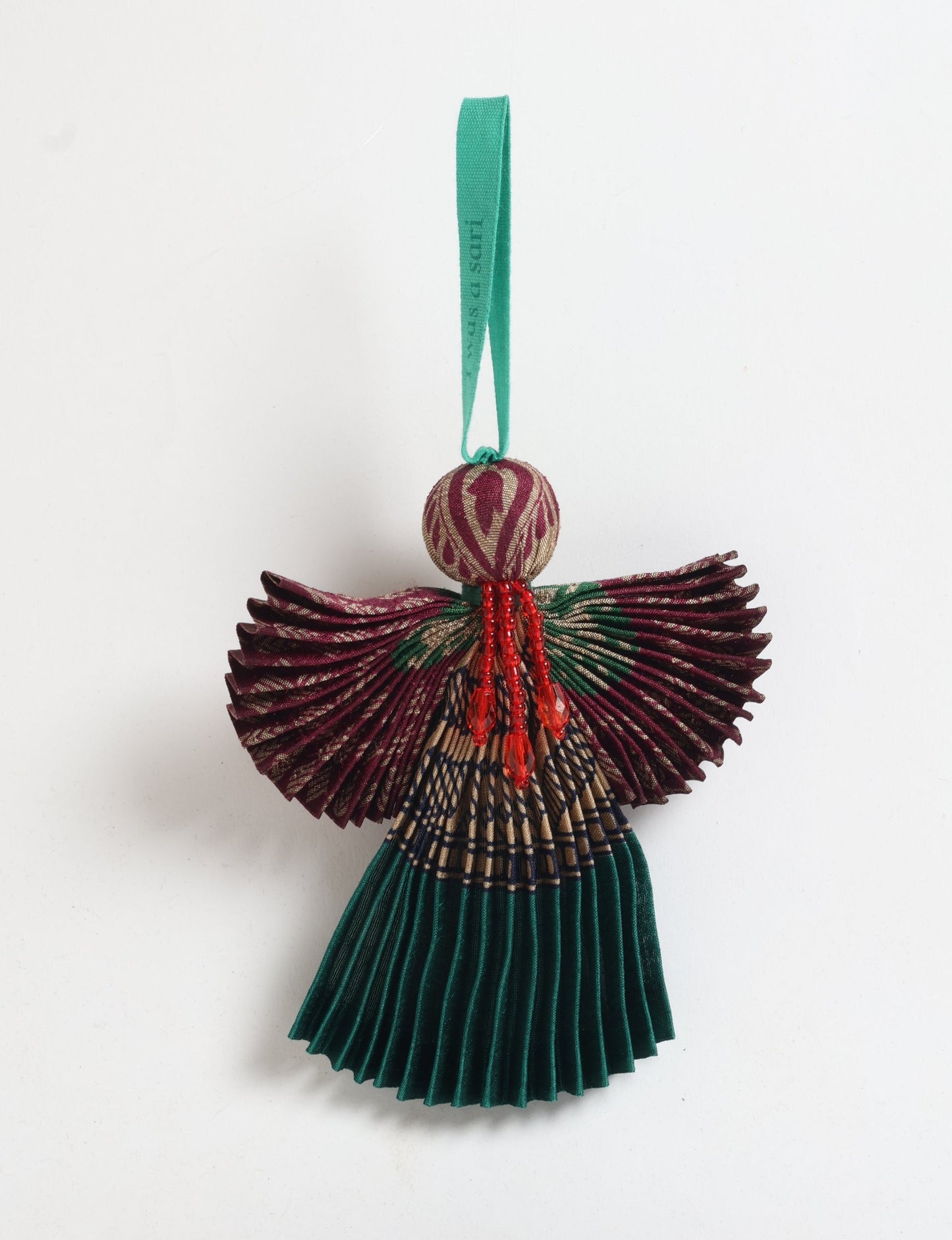 Angel Christmas Ornament made from upcycled saris, featuring pleated arms and body. A sustainable, eco-friendly holiday decoration, embodying recycled fashion and upcycling in festive style.






