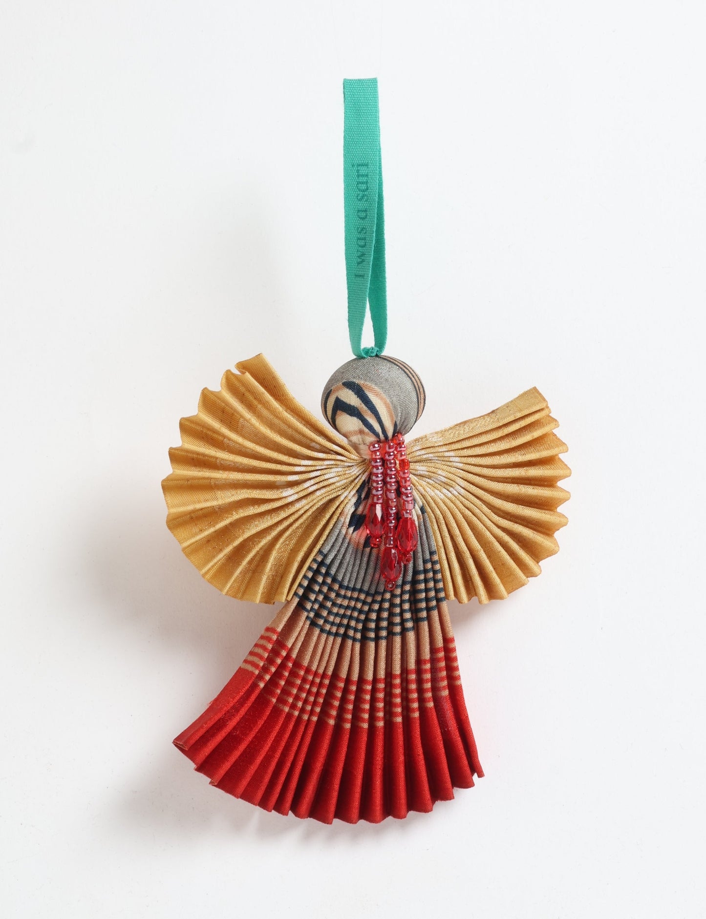 Angel Christmas Ornament made from upcycled saris, featuring pleated arms and body. A sustainable, eco-friendly holiday decoration, embodying recycled fashion and upcycling in festive style.





