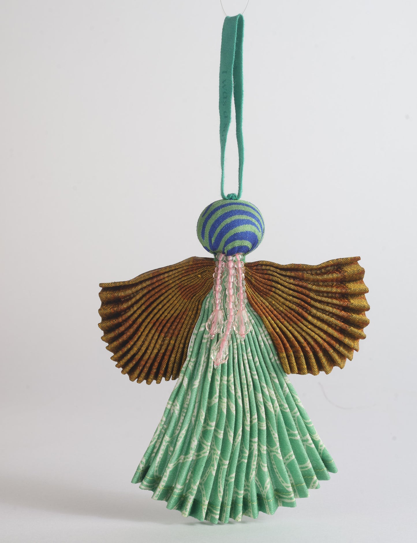 Angel Christmas Ornament made from upcycled saris, featuring pleated arms and body. A sustainable, eco-friendly holiday decoration, embodying recycled fashion and upcycling in festive style.





