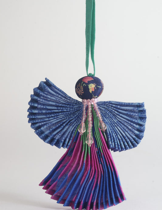 Angel Christmas Ornament made from upcycled saris, featuring pleated arms and body. A sustainable, eco-friendly holiday decoration, embodying recycled fashion and upcycling in festive style.





