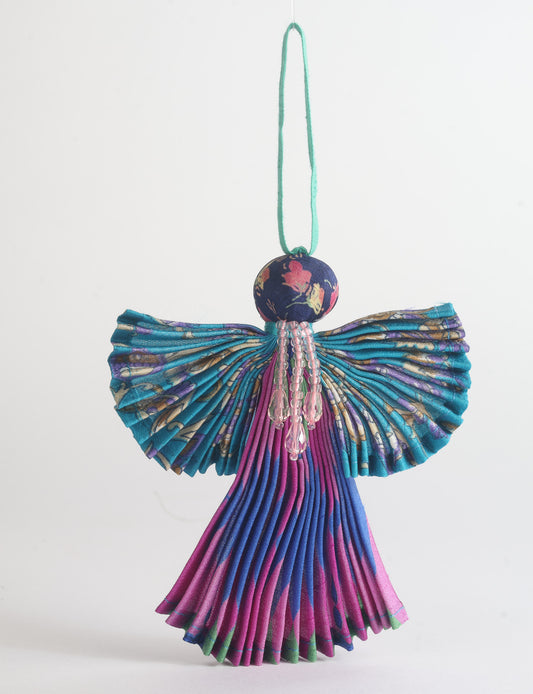Angel Christmas Ornament made from upcycled saris, featuring pleated arms and body. A sustainable, eco-friendly holiday decoration, embodying recycled fashion and upcycling in festive style.





