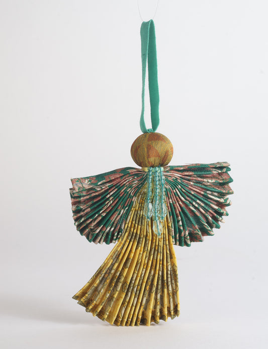 Angel Christmas Ornament made from upcycled saris, featuring pleated arms and body. A sustainable, eco-friendly holiday decoration, embodying recycled fashion and upcycling in festive style.





