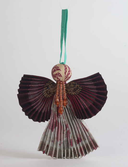 Angel Christmas Ornament made from upcycled saris, featuring pleated arms and body. A sustainable, eco-friendly holiday decoration, embodying recycled fashion and upcycling in festive style.





