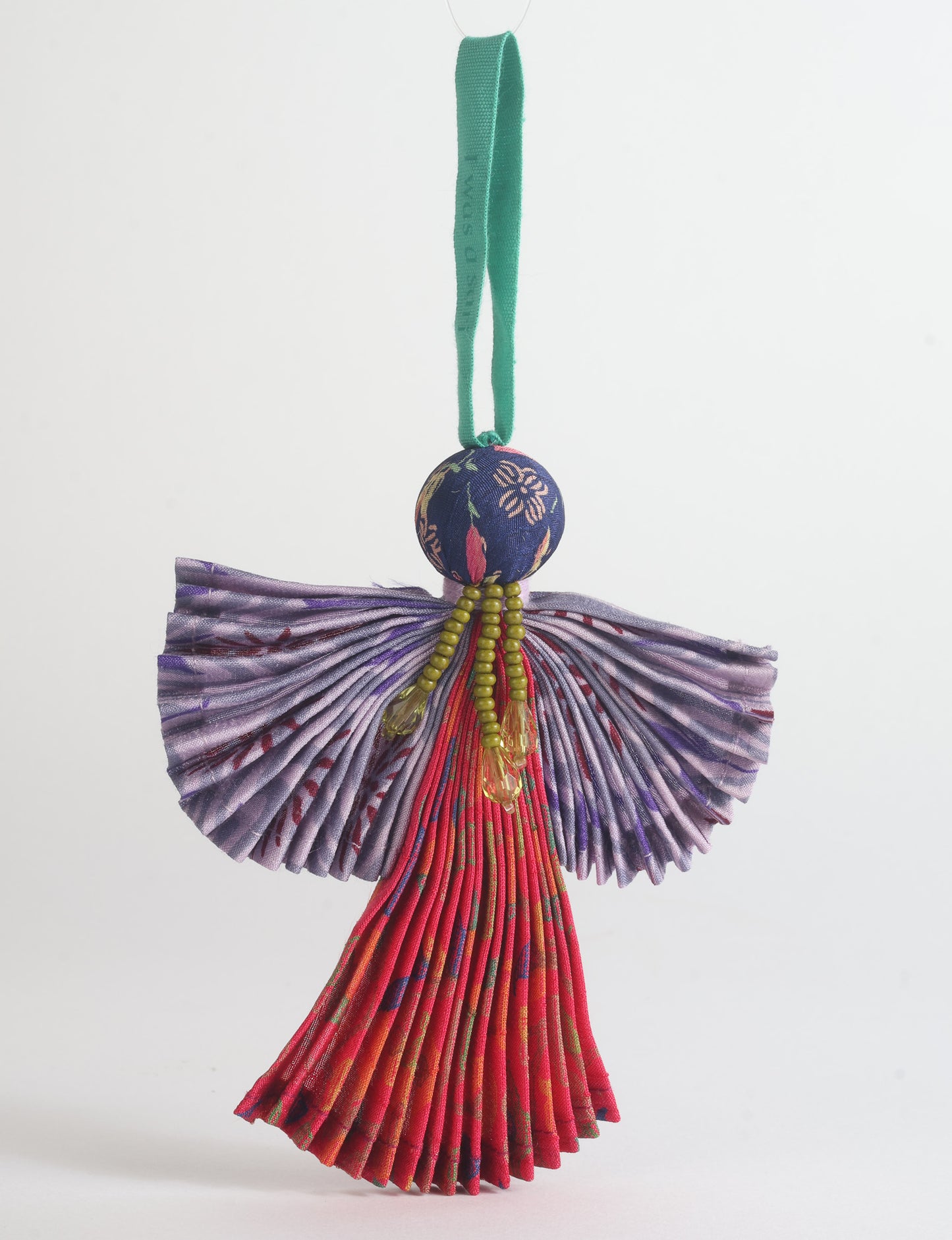 Angel Christmas Ornament made from upcycled saris, featuring pleated arms and body. A sustainable, eco-friendly holiday decoration, embodying recycled fashion and upcycling in festive style.





