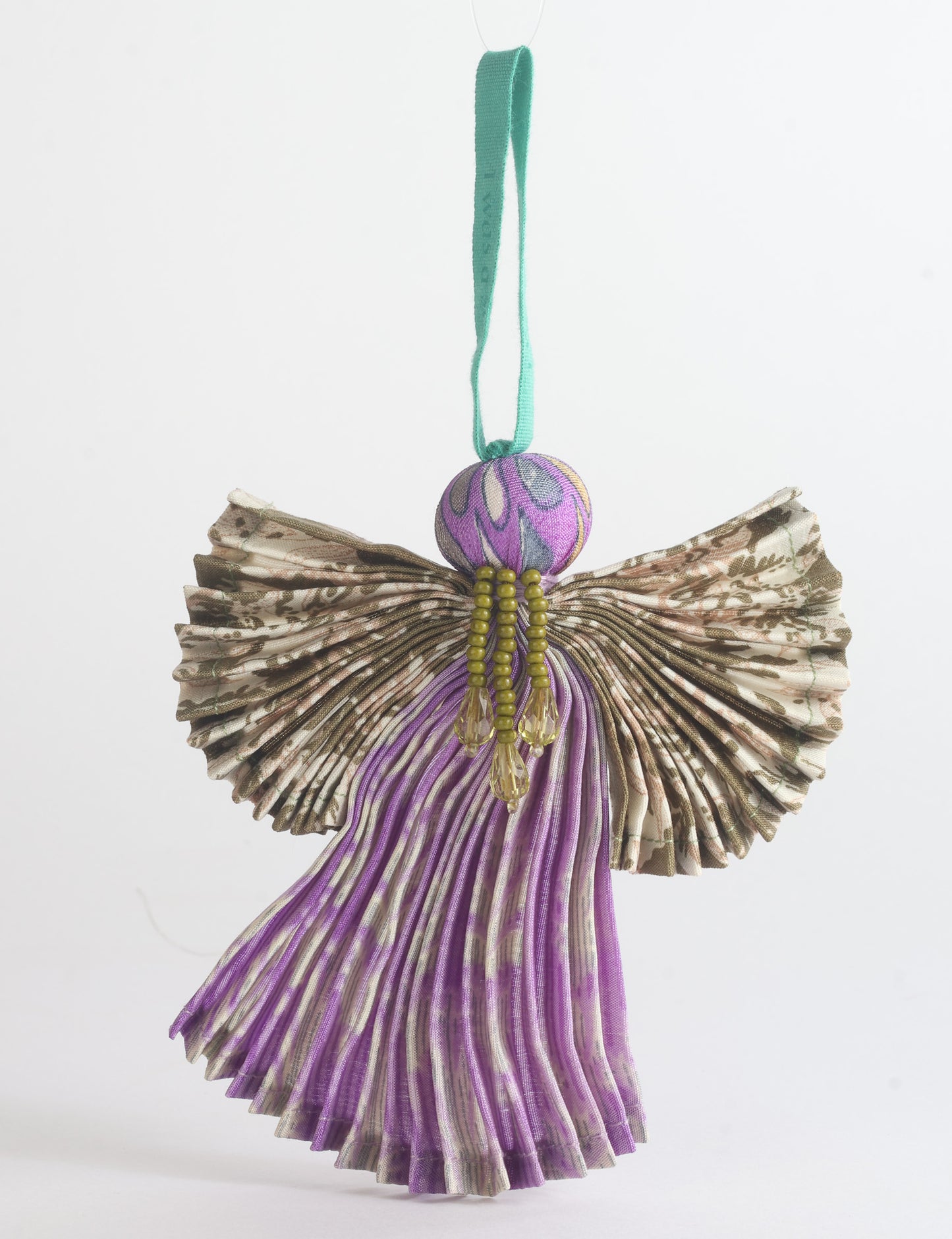 Angel Christmas Ornament made from upcycled saris, featuring pleated arms and body. A sustainable, eco-friendly holiday decoration, embodying recycled fashion and upcycling in festive style.





