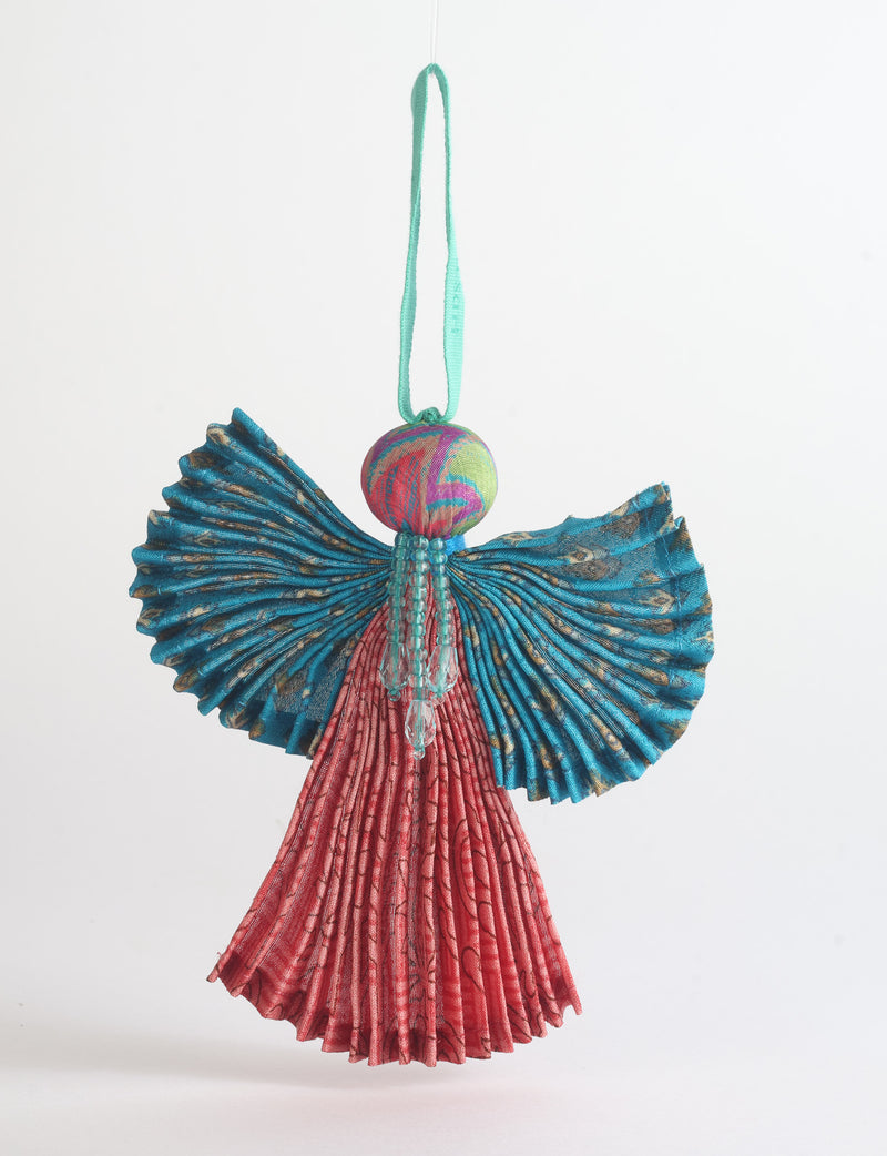 Angel Christmas Ornament made from upcycled saris, featuring pleated arms and body. A sustainable, eco-friendly holiday decoration, embodying recycled fashion and upcycling in festive style.





