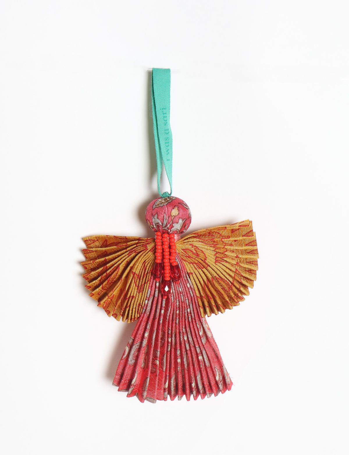 Angel Christmas Ornament made from upcycled saris, featuring pleated arms and body. A sustainable, eco-friendly holiday decoration, embodying recycled fashion and upcycling in festive style.





