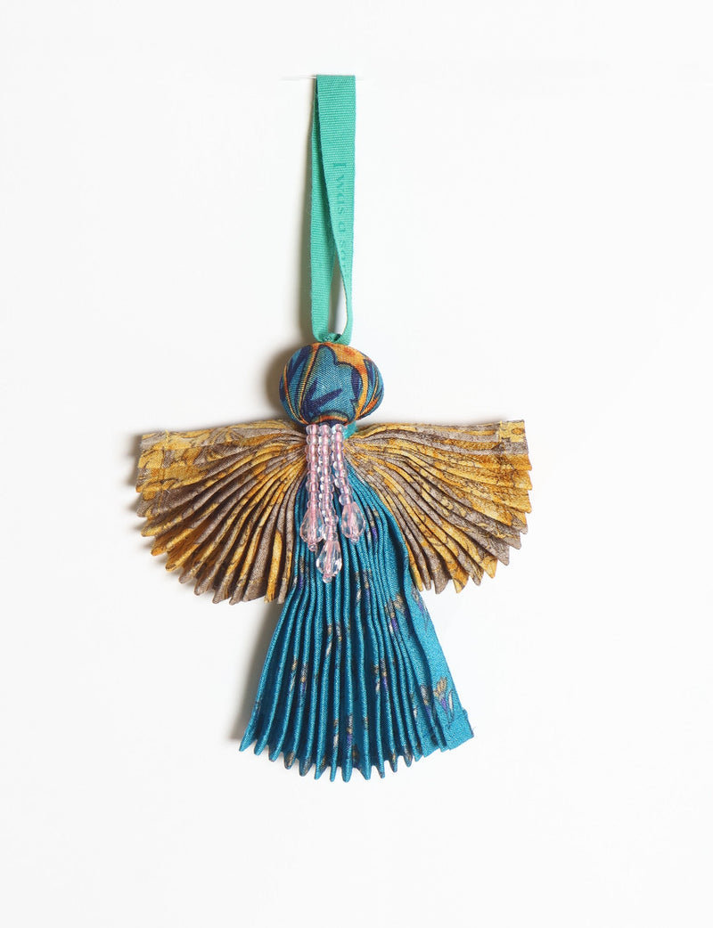 Angel Christmas Ornament made from upcycled saris, featuring pleated arms and body. A sustainable, eco-friendly holiday decoration, embodying recycled fashion and upcycling in festive style.





