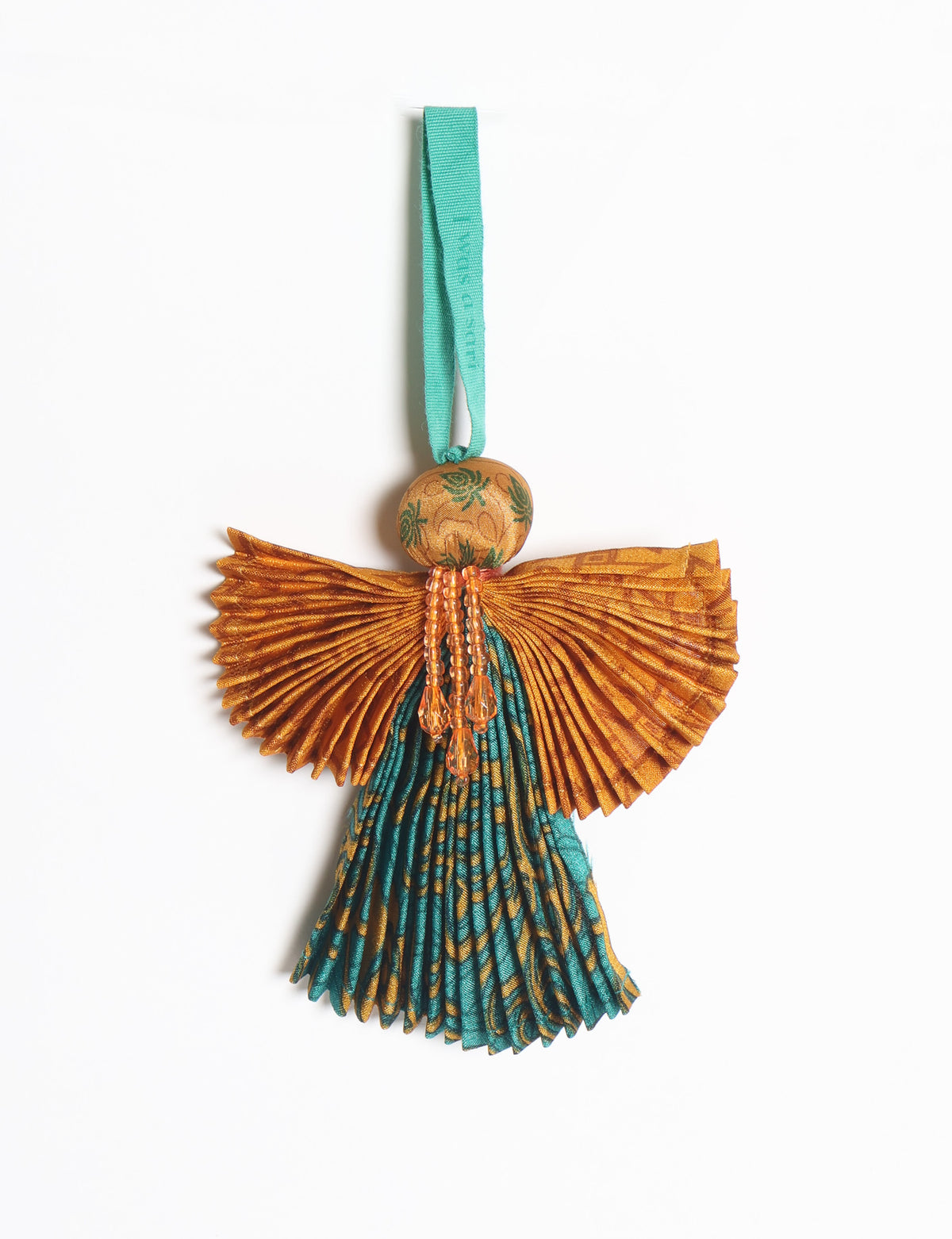 Angel Christmas Ornament made from upcycled saris, featuring pleated arms and body. A sustainable, eco-friendly holiday decoration, embodying recycled fashion and upcycling in festive style.





