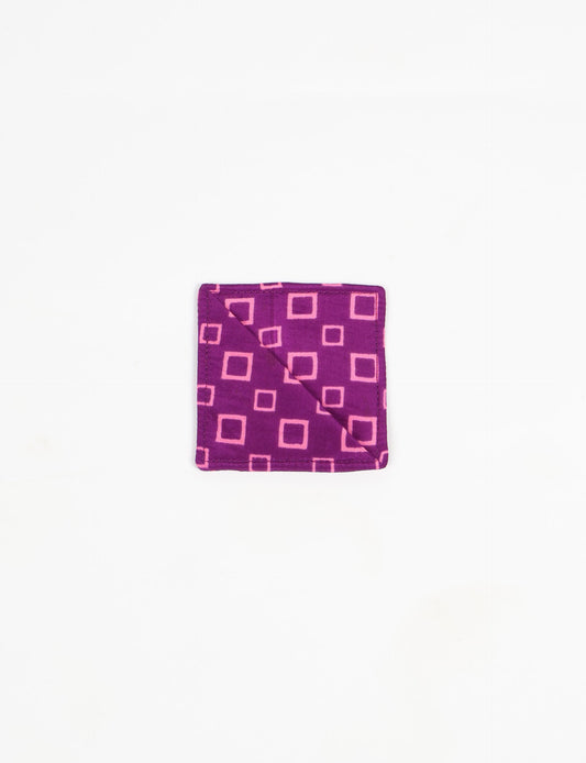 Colorful square-shaped corner bookmark made from recycled sari textiles, representing repurposed clothing, fair trade fashion, and ethical fashion. An earth-friendly product made from textile waste, aligning with carbon neutral clothing values.