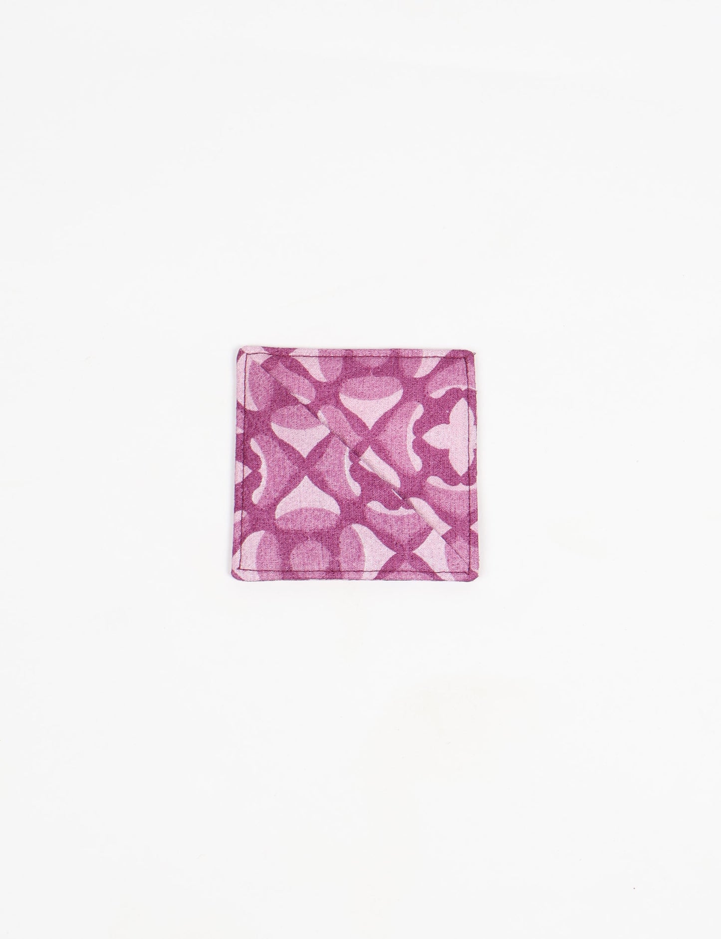 Colorful square-shaped corner bookmark made from recycled sari textiles, representing repurposed clothing, fair trade fashion, and ethical fashion. An earth-friendly product made from textile waste, aligning with carbon neutral clothing values.