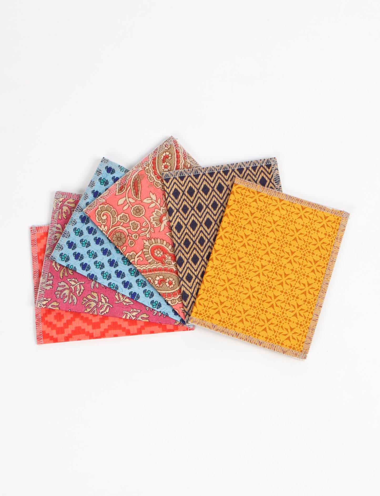 Folded Celebration Card Set, 6 pieces made from recycled sari fabric, showcasing sustainable, eco-friendly, and upcycled fashion principles. Ideal for sending wishes while supporting circular fashion, sustainable apparel, and environmentally friendly practices.