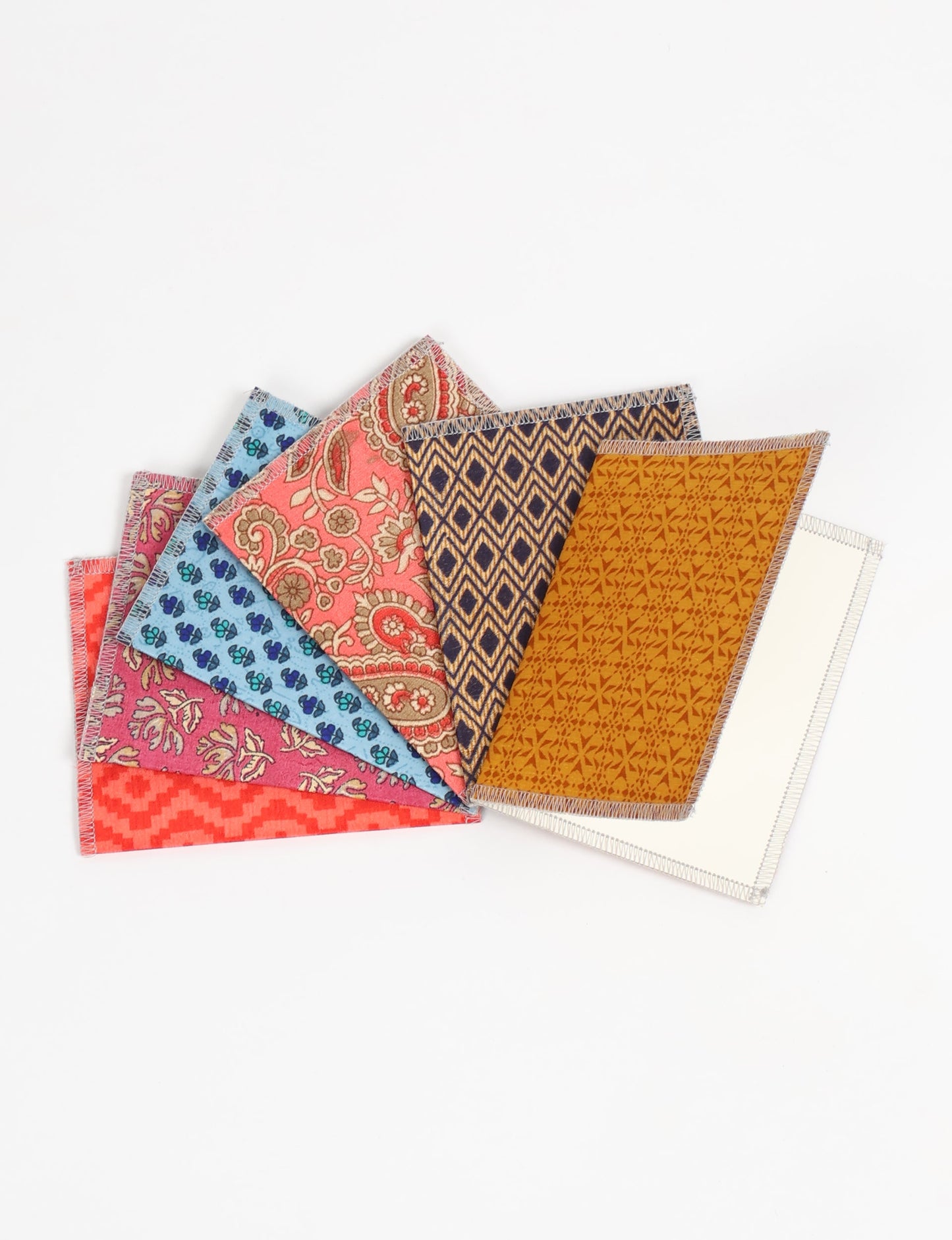 Folded Celebration Card Set, 6 pieces made from recycled sari fabric, showcasing sustainable, eco-friendly, and upcycled fashion principles. Ideal for sending wishes while supporting circular fashion, sustainable apparel, and environmentally friendly practices.