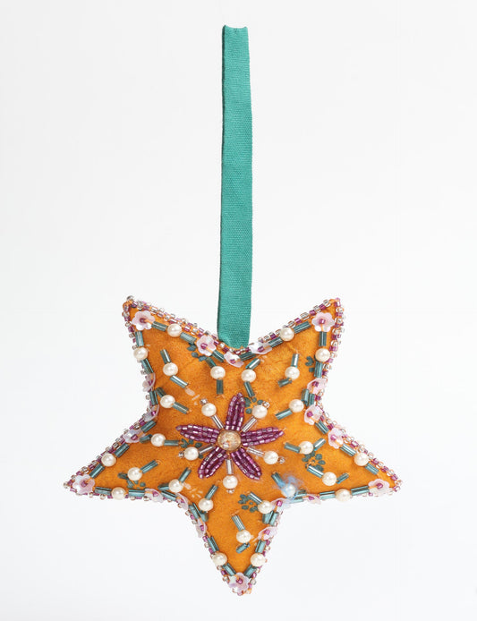 Christmas Star Ornaments made from upcycled saris with hand-embroidered Aari work, showcasing sustainable fashion and eco-friendly craftsmanship for ethical and green holiday decor.