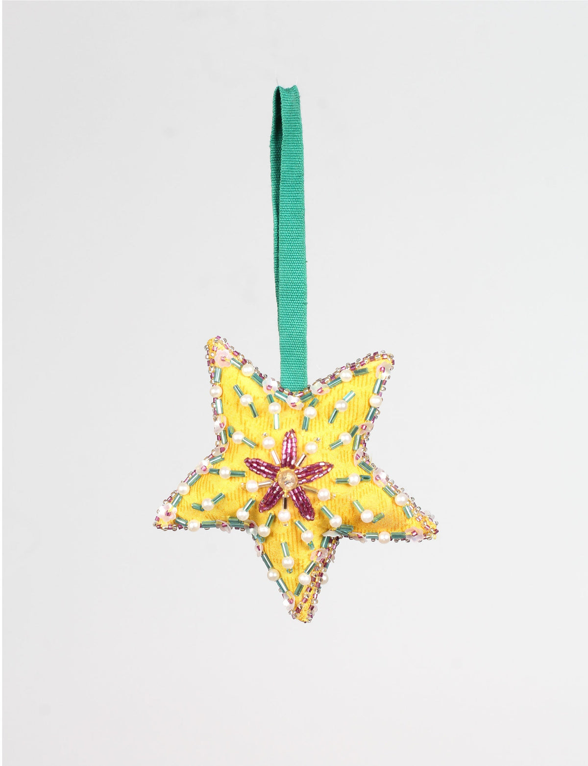 Yellow fabric star ornament with green, pink, and pearl bead embellishments and a green hanging loop