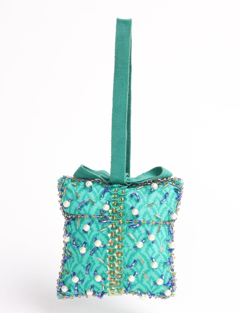 Green fabric gift-shaped ornament with blue, gold, and pearl bead embellishments and a green hanging loop