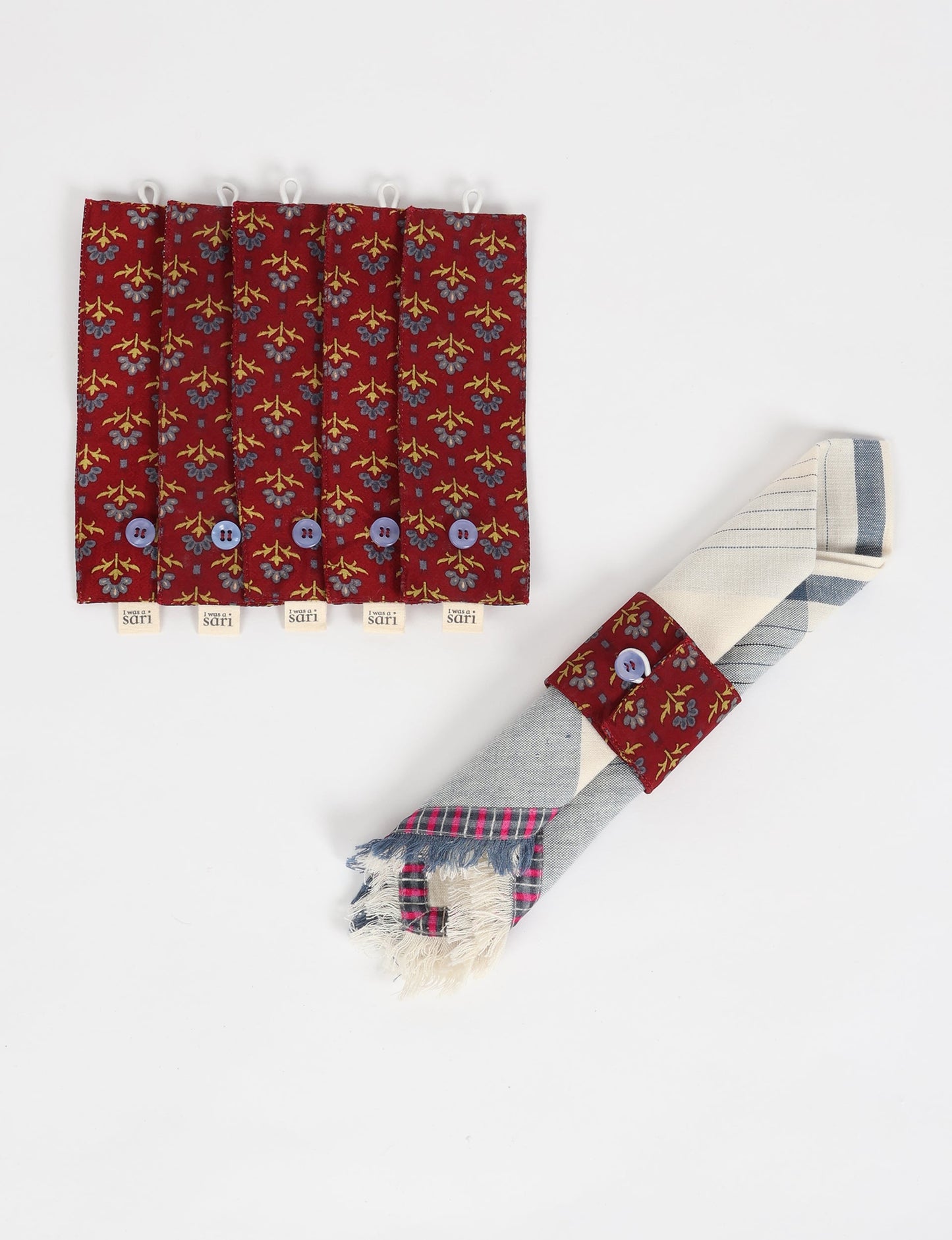 A set of 6 napkin rings made from repurposed saris, showcasing the beauty of sustainable fashion and upcycled materials. These stylish, eco-friendly rings with button closures are ideal for adding a touch of environmentally conscious elegance to your dining table.





