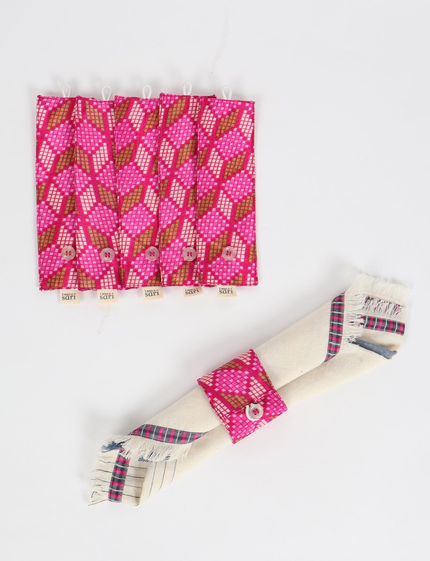 A set of 6 napkin rings made from repurposed saris, showcasing the beauty of sustainable fashion and upcycled materials. These stylish, eco-friendly rings with button closures are ideal for adding a touch of environmentally conscious elegance to your dining table.






