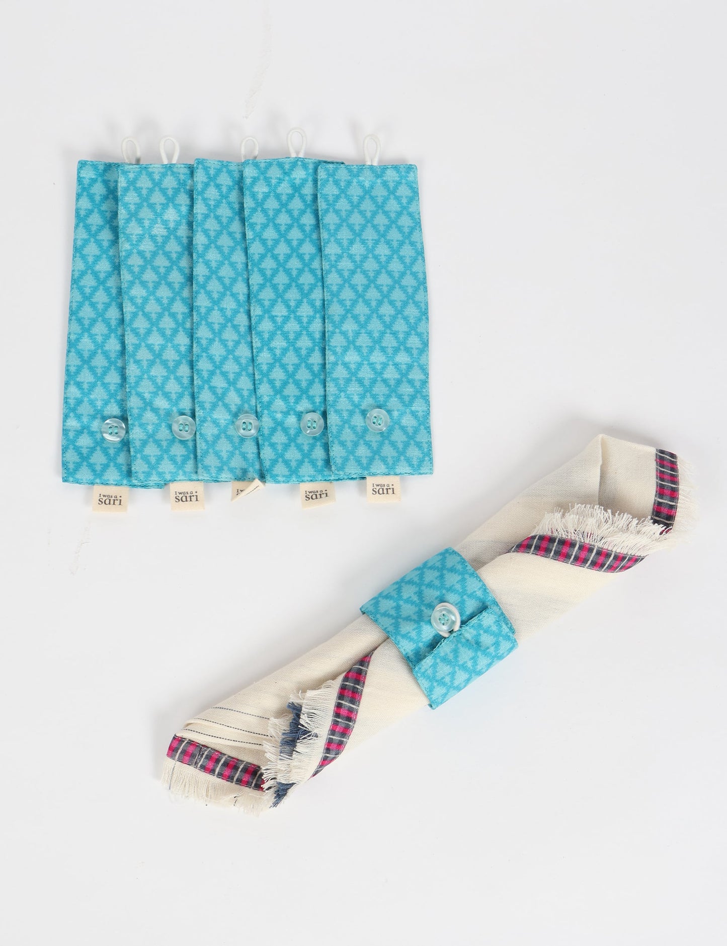 A set of 6 napkin rings made from repurposed saris, showcasing the beauty of sustainable fashion and upcycled materials. These stylish, eco-friendly rings with button closures are ideal for adding a touch of environmentally conscious elegance to your dining table.





